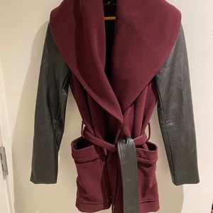 Unique maroon jacket with leather sleeves.